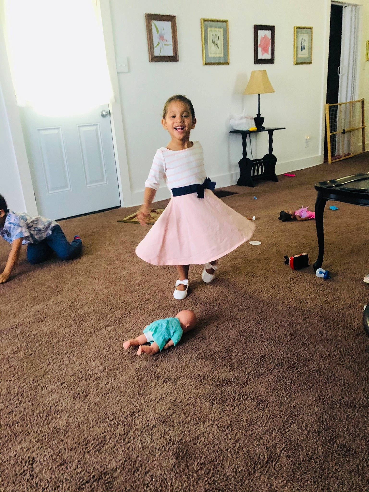 Aniya is registered to the contest to win money with this photo: baby_toddler_clothing, child, door, dress, fashion_design, floor, flooring, fun, hardwood, human_leg, joint, joy, laminate_flooring, leg, person, picture_frame, shoe, sitting, standing, toddler