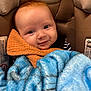 baby, infant, car_seat, blanket, blue_blanket, orange_cloth, smiling, face, eyes, child, young, cute, cozy, warm, comfort, seat, fabric, closeup, portrait, indoor