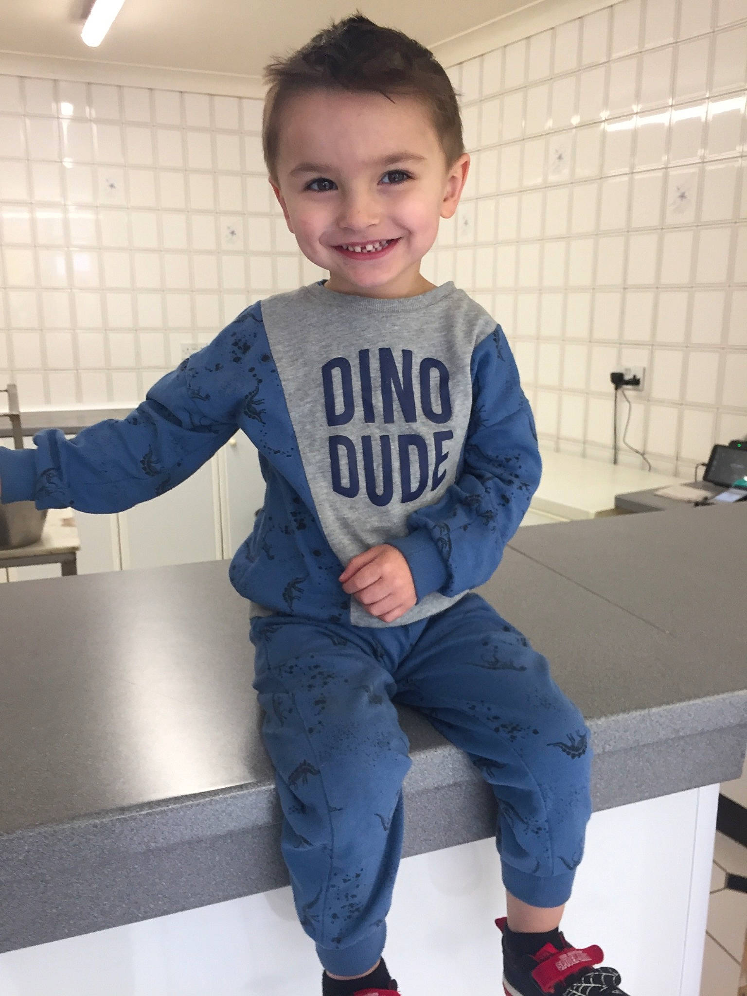 Ellis is registered to the contest to win money with this photo: baby_toddler_clothing, child, denim, electric_blue, flash_photography, footwear, happy, human_leg, joint, joy, knee, leg, person, shoulder, sleeve, smile, sneakers, sportswear, standing, sweatpant