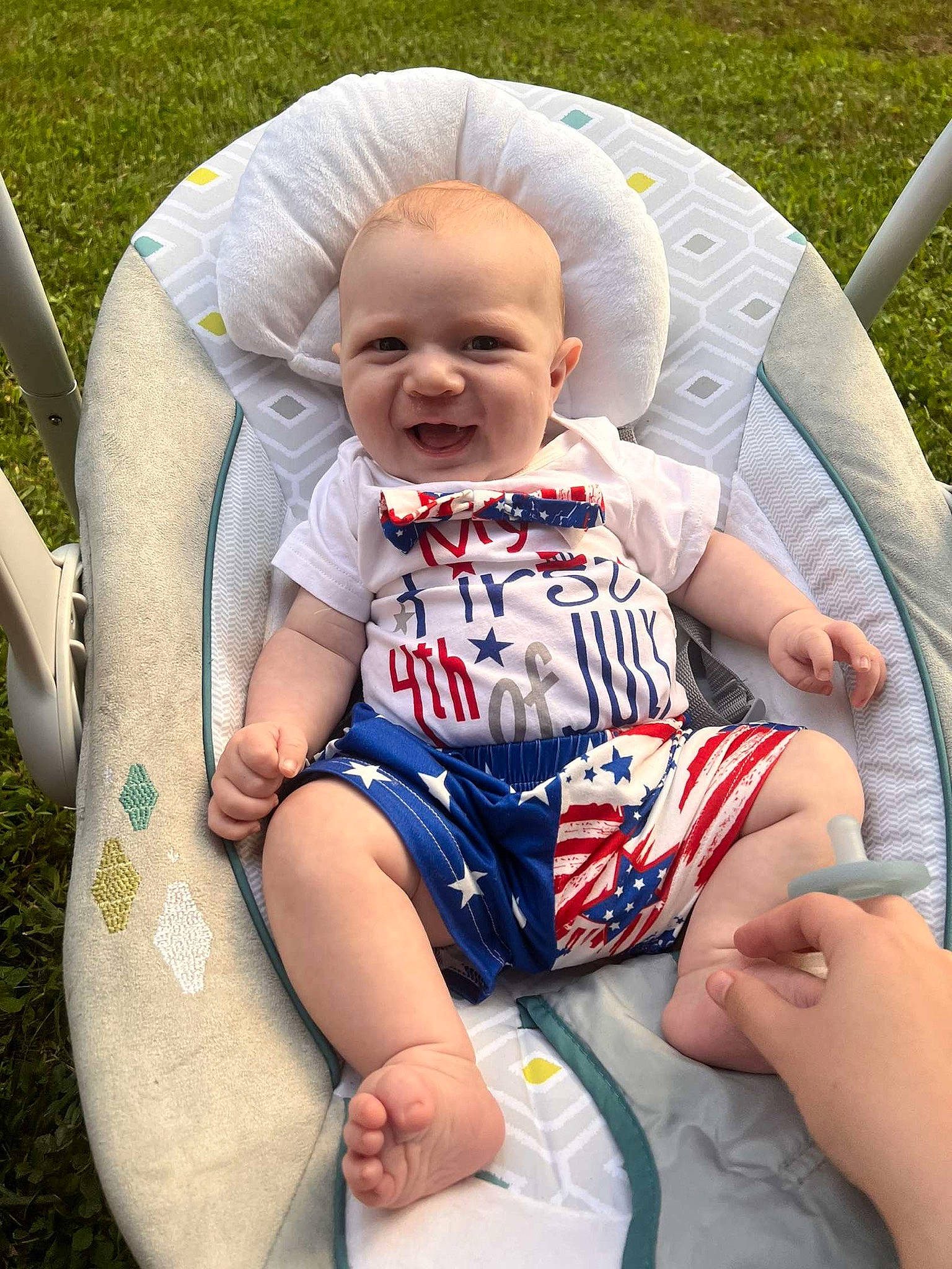 Colt is registered to the contest to win money with this photo: baby, baby_carriage, baby_toddler_clothing, chair, comfort, face, finger, fun, grass, hand, happy, head, human_body, lap, leisure, person, plant, skin, smile, thigh