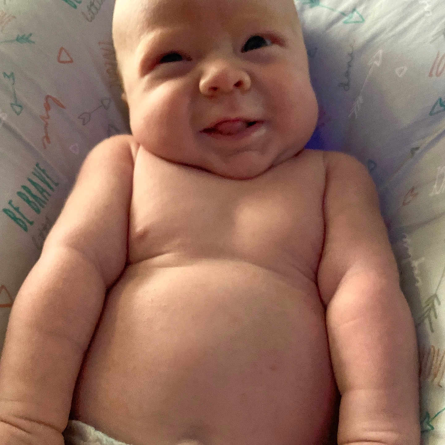 Wayden joined the competition — help win amazing prizes! arm, baby, bare_chest, child, chubby, closeup, comfort, cute, diaper, face, hand, infant, lying_down, pattern, pillow, portrait, skin, smile, text, tongue