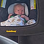 Wayden is registered to the contest to win money with this photo: baby, infant, car_seat, blanket, animal_print, child, indoors, seat, clothing, cute, face, head, newborn, safety, car_seat_strap, person, portrait, comfort, resting, young