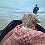 Iléana participe au concours pour gagner de l'argent avec cette photo : dog, blanket, beach, ocean, water, person, cloudy_sky, stroller, sand, fur, outdoor, nature, relaxation, pet, cape, calm, seaside, scenery, leisure, walking