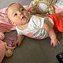 Amelia joined the competition — help win amazing prizes! baby, infant, toy, plush_giraffe, mermaid_doll, blanket, pink_blanket, white_shirt, orange_pants, face, hand, bed, soft_toys, cute, child, indoor, looking_up, skin, expression, laying_down