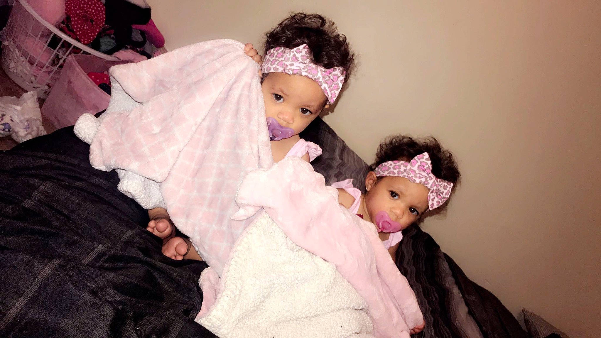 Maisyn Kaicyn is registered to the contest to win money with this photo: baby, black_hair, cheek, child, eye, hair_accessory, headpiece, headwear, person, pink, smile, toddler