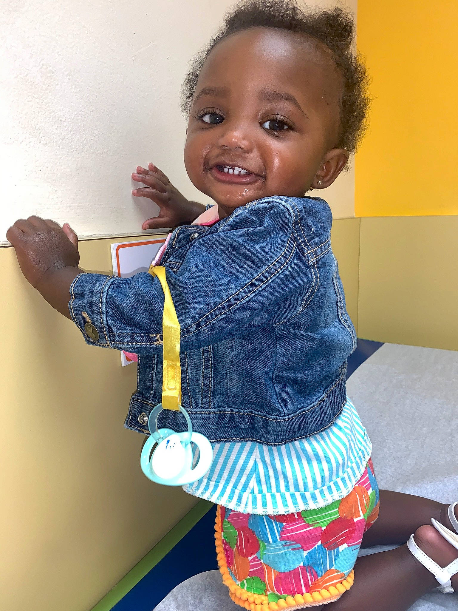Jniya is registered to the contest to win money with this photo: cheek, child, denim, finger, happy, jeans, joy, person, play, skin, smile, standing, textile, toddler