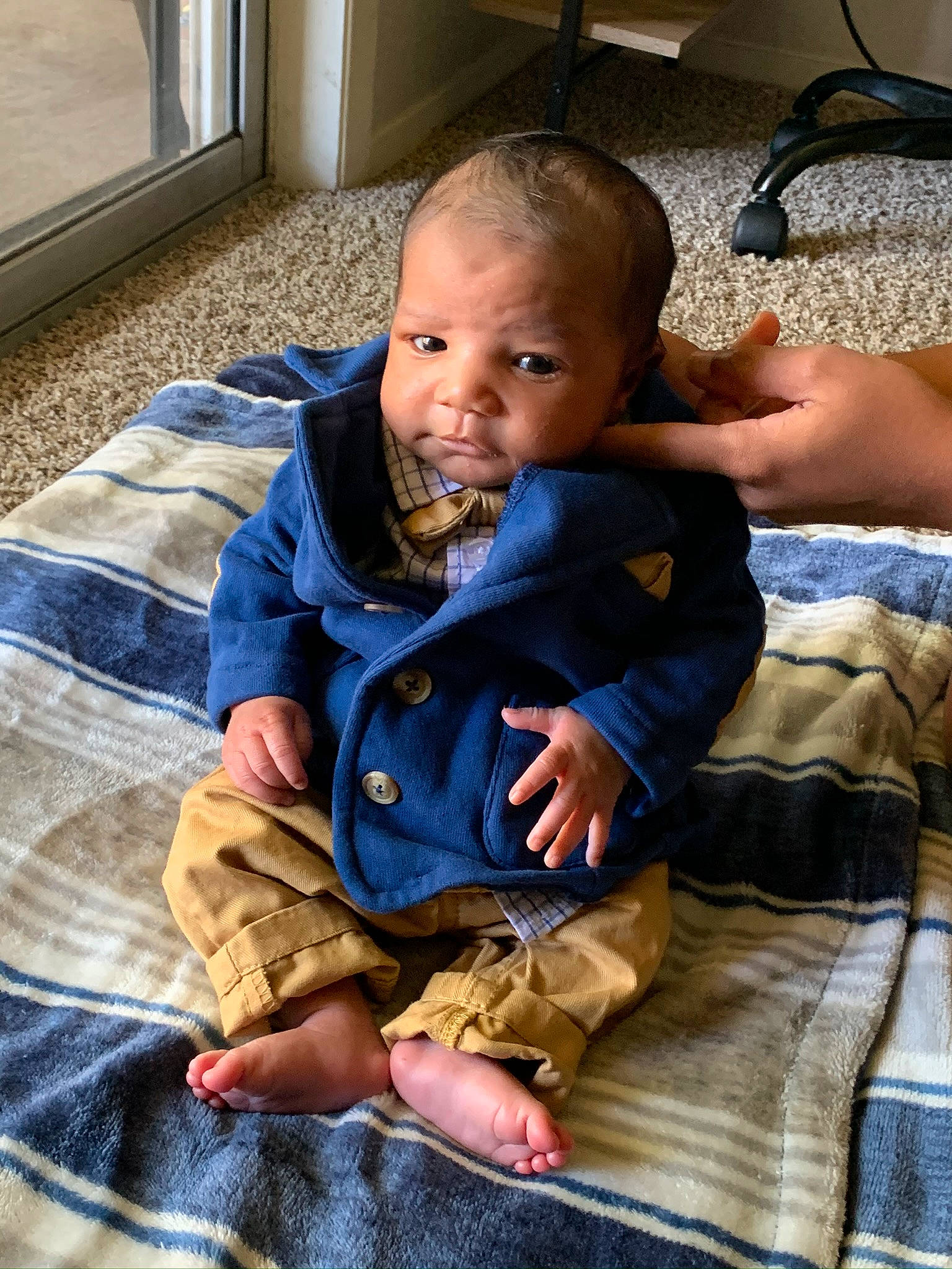 Jalen Jr. is registered to the contest to win money with this photo: baby, cheek, child, face, head, people, person, sitting, skin, smile, toddler