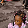 Genesis is registered to the contest to win money with this photo: child, girl, braids, beads, pink_clothing, store, carpet, footwear, people, shopping, shelf, indoor, patterned_clothing, person, walking, retail, casual, floor, blurred, young