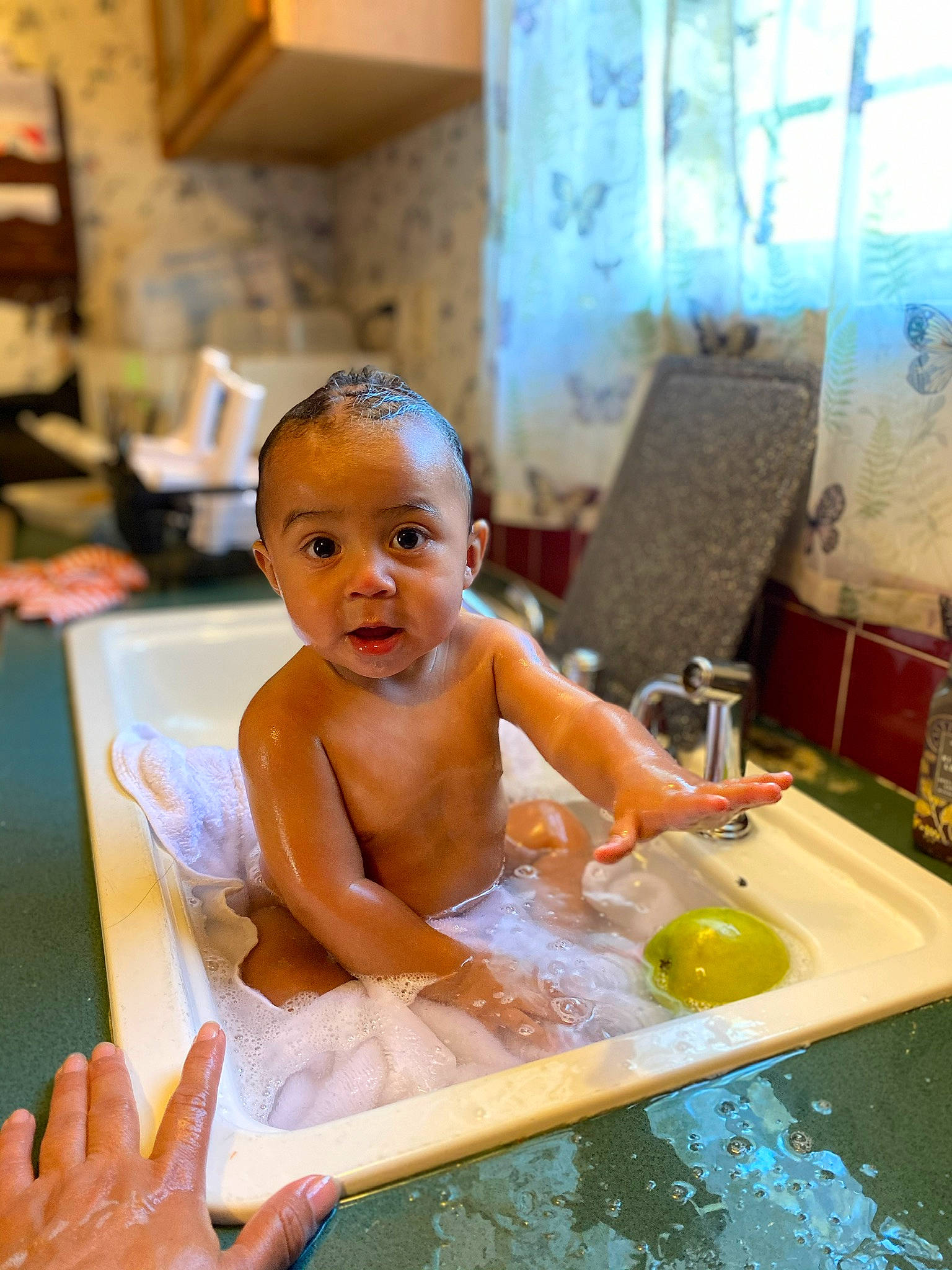 Nathanael is registered to the contest to win money with this photo: baby, barechested, bathing, bathroom, bathtub, chest, child, fluid, fun, hand, leisure, person, play, plumbing, plumbing_fixture, recreation, summer, surprise, swimming_pool, tap