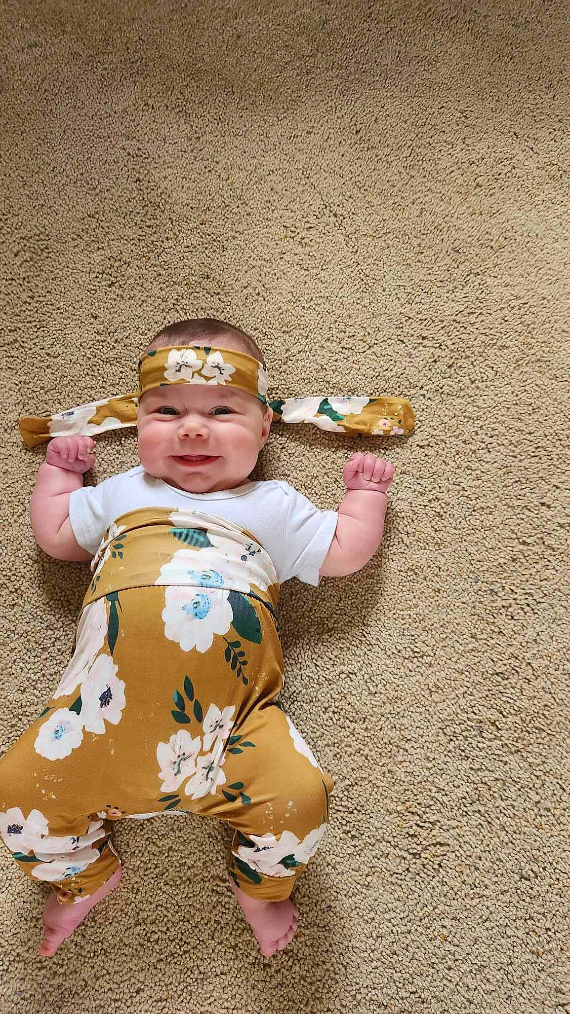 Cheyenne is registered to the contest to win money with this photo: baby, baby_toddler_clothing, child, costume, fun, grass, happy, hat, headwear, joy, pattern, person, personal_protective_equipment, play, sitting, sleeve, thumb, toddler