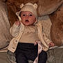 Isla-Capri joined the competition — help win amazing prizes! baby, bodypart, bonnet, cap, clothing, coat, couch, face, finger, furniture, hand, hat, head, knitwear, pants, person, photography, portrait, sitting, sweater