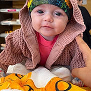 Isla-Capri is registered to the contest to win money with this photo: baby, beanie, blanket, bonnet, cap, clothing, coat, face, happy, hat, head, hood, jacket, knitwear, newborn, person, photography, portrait, smile, sweater