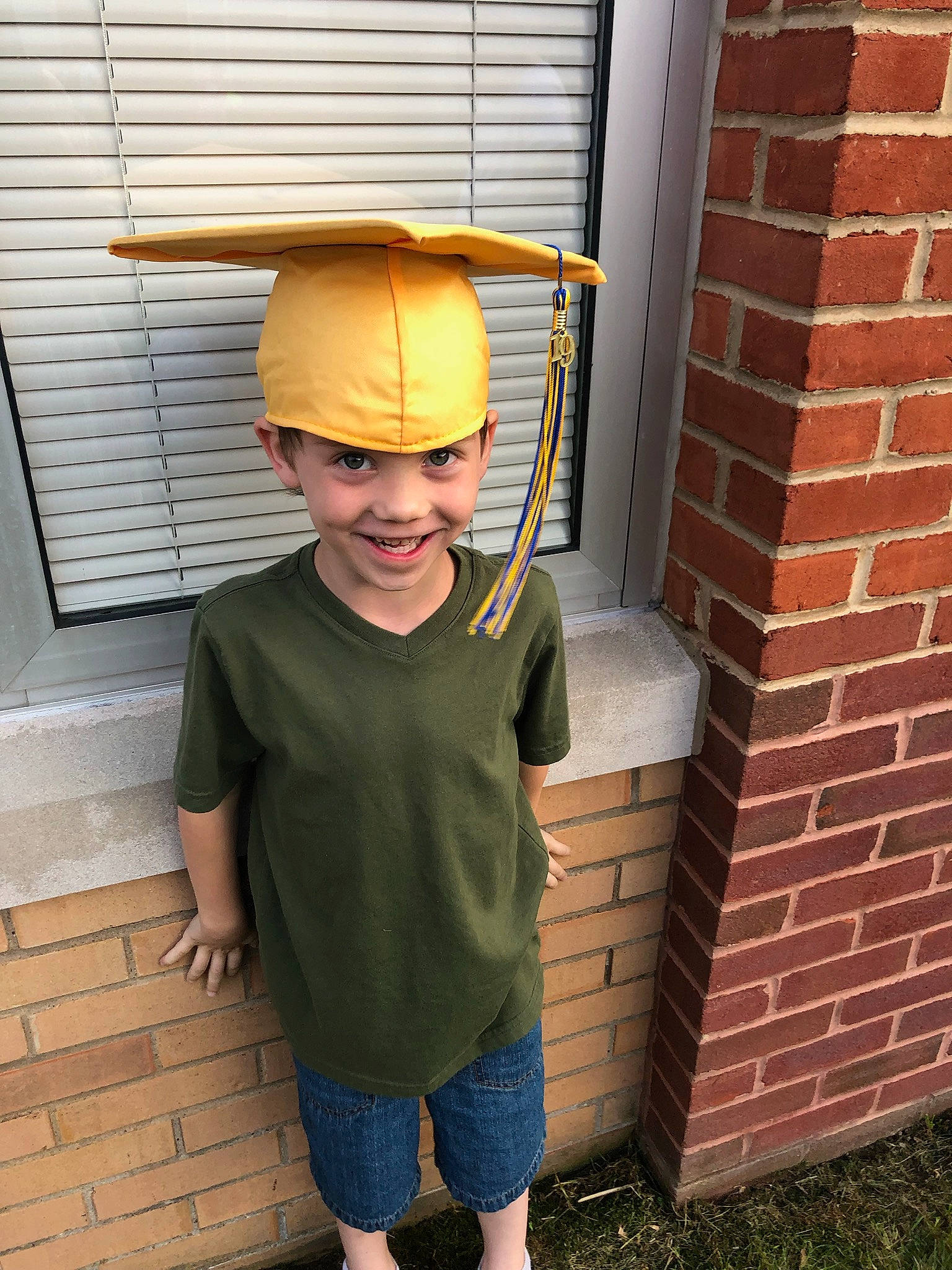Maddoxx is registered to the contest to win money with this photo: brick, brickwork, fashion_accessory, hat, headgear, joy, person, standing, sun_hat