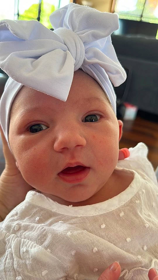 Juliette joined the competition — help win amazing prizes! baby, cap, cheek, chin, ear, eye, eyebrow, eyelash, face, happy, headgear, headpiece, headwear, lip, nose, person, pink, skin, sleeve, smile