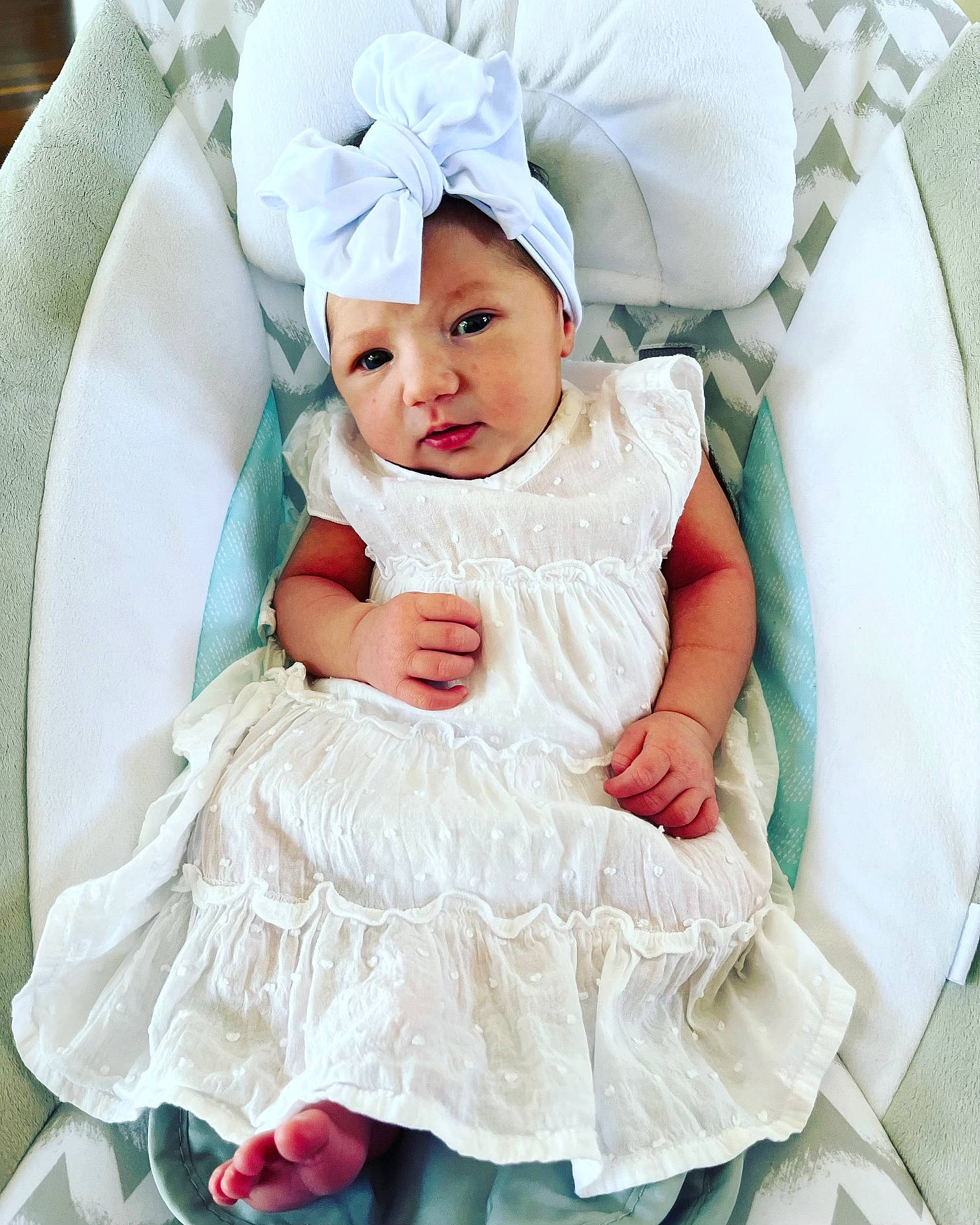 Juliette is registered to the contest to win money with this photo: aqua, azure, baby, baby_toddler_clothing, chair, child, comfort, event, fashion_accessory, hair_accessory, happy, headwear, linens, pattern, person, pink, product, sitting, sleeve, textile