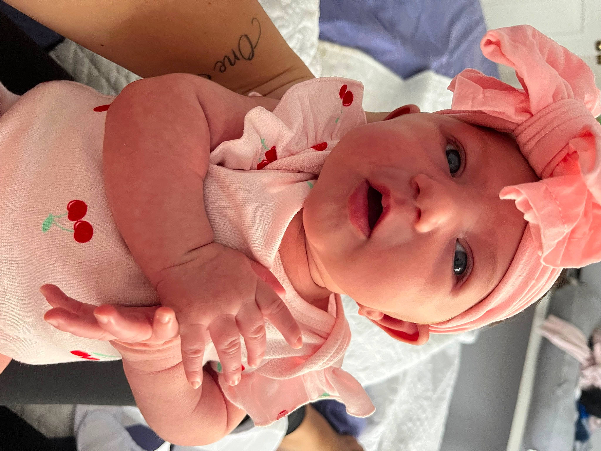 Juliette is registered to the contest to win money with this photo: baby, baby_toddler_clothing, cheek, child, event, eyelash, facial_expression, finger, fun, happy, hat, headwear, lip, mammal, mouth, nail, person, pink, product, skin