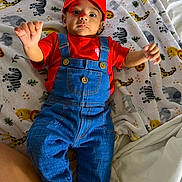 Máximo joined the competition — help win amazing prizes! animal_print, baby, bed, blanket, child, clothing, cute, denim, elephant, giraffe, indoors, infant, lion, mario, overalls, person, portrait, red_hat, smiling, zebra