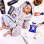 Máximo is registered to the contest to win money with this photo: baby, blanket, blue, candle, chocolate, cosmetics, cupcake, cute, infant, lotion, lying_down, newborn, perfume, product_arrangement, robe, skin_care, small_hand, soft_texture, teddy_bear_pattern, white_background