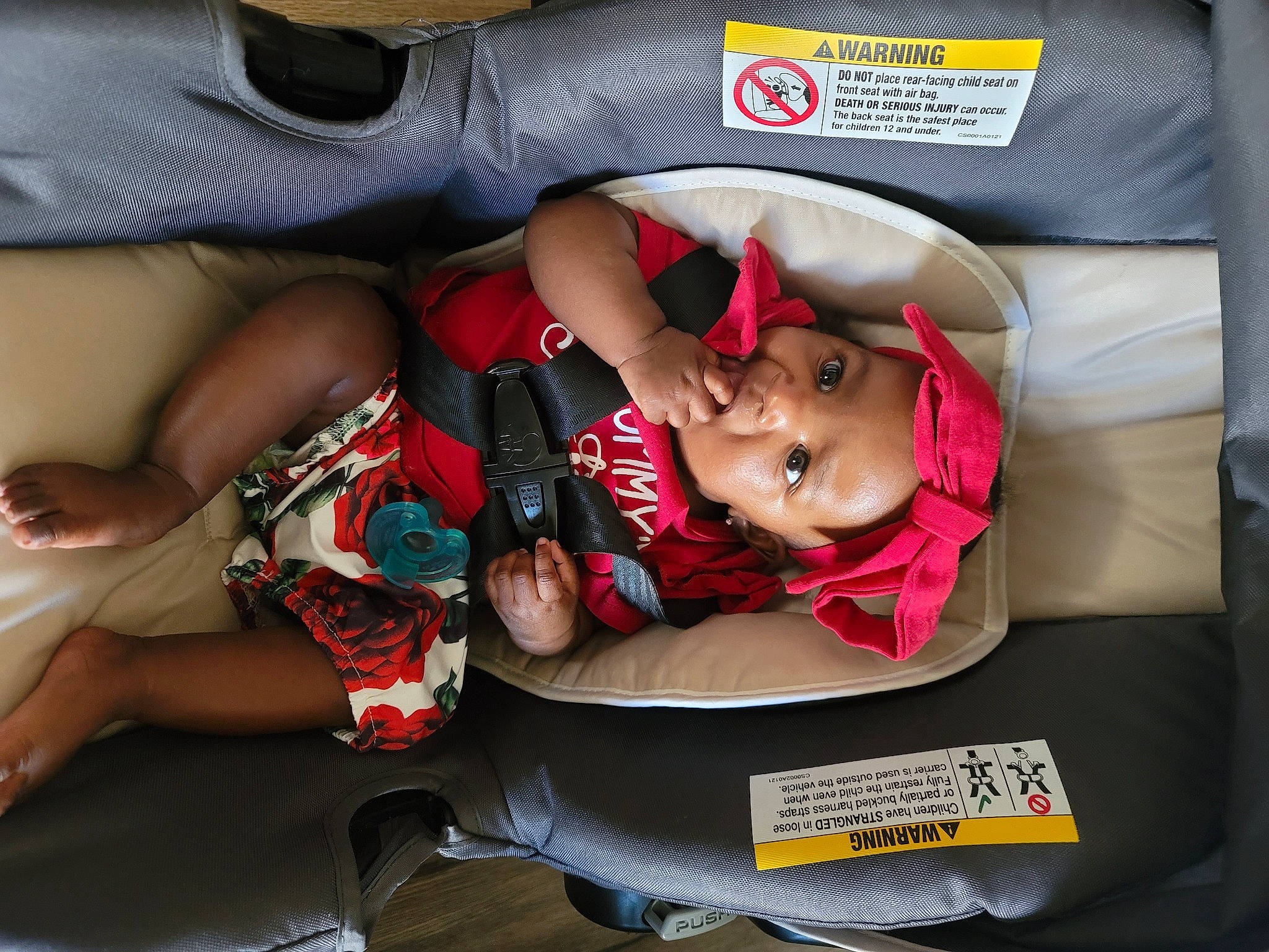 Kehlani is registered to the contest to win money with this photo: auto_part, automotive_exterior, baby, baby_carriage, baby_in_car_seat, baby_products, car_seat, carmine, child, comfort, family_car, fun, headwear, human_leg, knee, lap, motor_vehicle, person, sitting, thigh