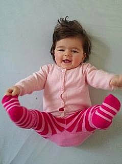 Elena participe au concours pour gagner de l'argent avec cette photo : arm, baby, baby_toddler_clothing, child, child_model, clothing, finger, leotard, pattern, person, pink, product, sleeve, sportswear, toddler