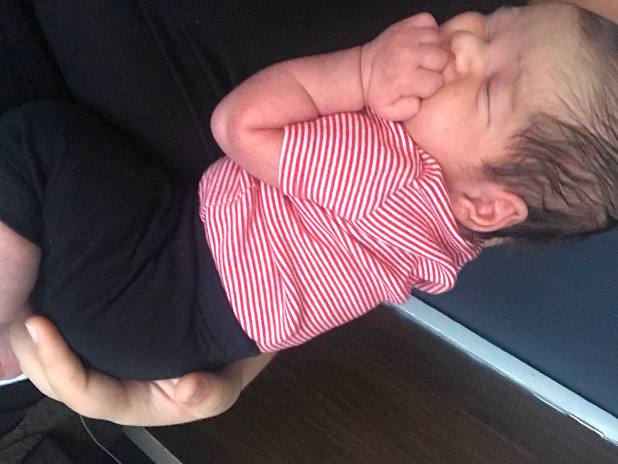 Xavier is registered to the contest to win money with this photo: arm, baby, baby_sleeping, baby_toddler_clothing, comfort, elbow, eyelash, finger, gesture, hand, iris, joint, lip, mouth, nail, neck, nose, person, skin, sleeve