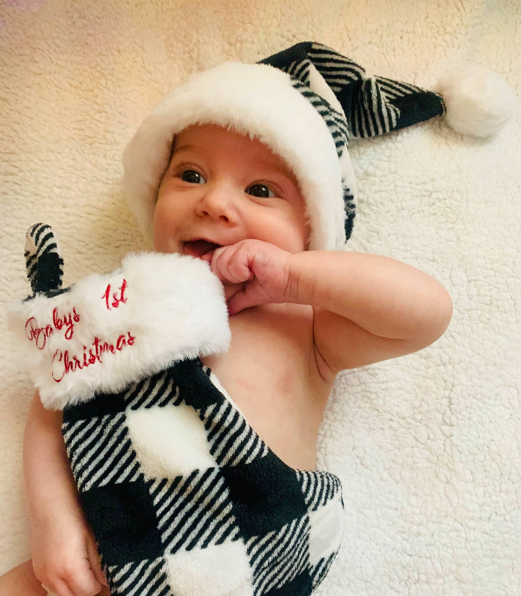 Justin is registered to the contest to win money with this photo: arm, baby, baby_sleeping, baby_toddler_clothing, cap, child, eyelash, facial_expression, finger, gesture, happy, headgear, headwear, nail, person, pink, skin, sleeve, textile, thumb