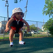 Azan joined the competition — help win amazing prizes! baby, casual_clothing, child, daylight, fence, fun, happy, hat, outdoor, park, playground, recreation, residential, sky, socks, summer, swing, toddler, trees, young_child