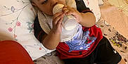 Azan joined the competition — help win amazing prizes! baby, blanket, bottle, carpet, child, clothing, colorful, cute, drinking, face, home, indoor, pattern, person, pillow, relaxing, socks, soft, spiderman, toddler