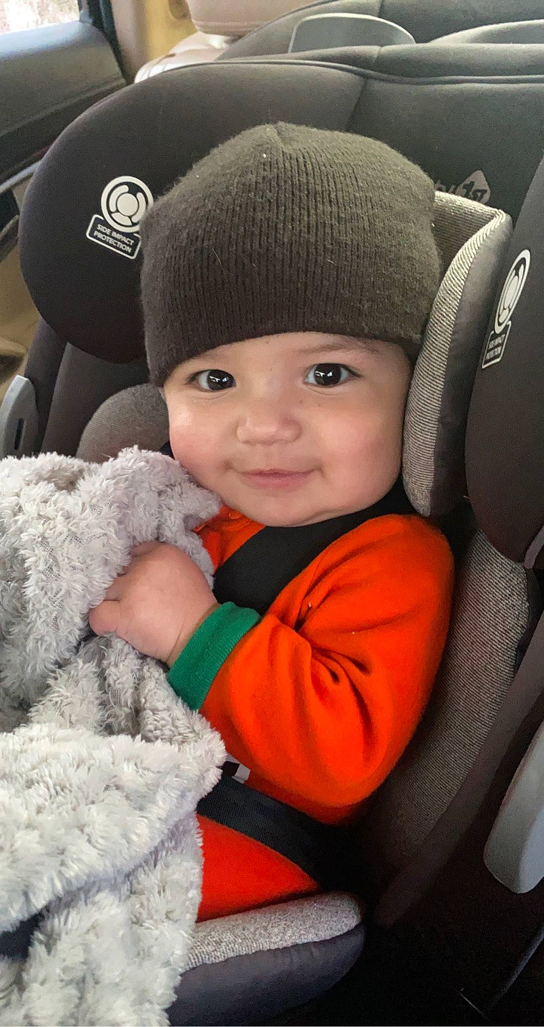 Luciano joined the competition — help win amazing prizes! baby, baby_toddler_clothing, cap, car_seat, cheek, child, close_up, comfort, face, facial_expression, flash_photography, fur, happy, headwear, joy, knit_cap, person, skin, smile, snapshot