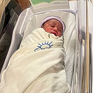 Jacory joined the competition — help win amazing prizes! newborn, baby, hospital, bassinet, blanket, sleeping, infant, swaddle, sign, warning, crib, hat, face, peaceful, soft, white, blue, text, parenting, healthcare