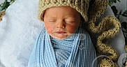 Zandyr is registered to the contest to win money with this photo: newborn, baby, sleeping, knit_hat, blue_blanket, basket, greenery, white_blanket, wrapped, peaceful, portrait, infant, cute, cozy, soft_texture, headwear, sleep, indoors, baby_photography, resting