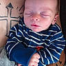 baby, newborn, sleeping, striped_clothing, blue, infant, tattoos, arm, hospital_wristband, blanket, hand, person, closeup, peaceful, cute, indoor, skin, resting, portrait, child