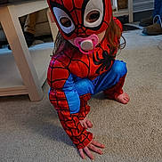 Zaylee joined the competition — help win amazing prizes! child, costume, spiderman, pacifier, indoor, carpet, crouching, superhero, mask, barefoot, person, toy, play, home, cute, kid, red, blue, fingers, hair