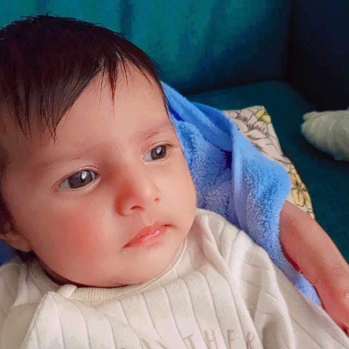 Paramjot is registered to the contest to win money with this photo: baby, blanket, bodypart, clothing, couch, cushion, face, finger, furniture, hand, head, homedecor, knitwear, linen, newborn, person, photography, portrait, sweater, towel