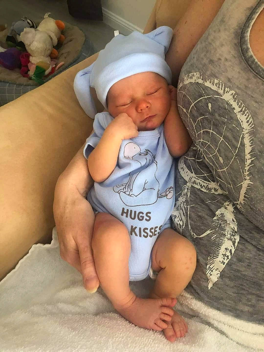 Cayden is registered to the contest to win money with this photo: abdomen, baby, baby_toddler_clothing, cap, chest, comfort, diaper, elbow, finger, headgear, headwear, human_leg, leg, mouth, muscle, person, skin, stomach, thigh, thumb