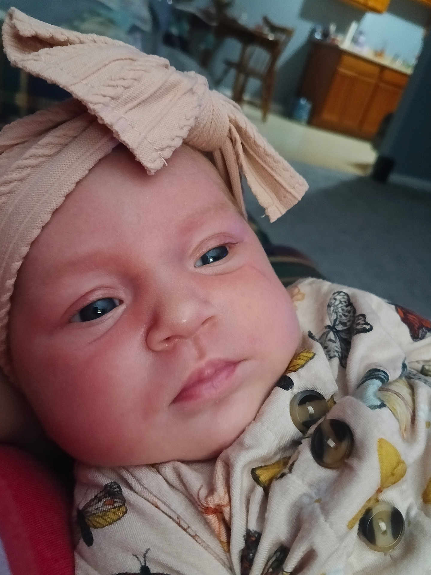 Arielle is registered to the contest to win money with this photo: baby, infant, headband, bow, face, closeup, clothing, pattern, butterfly, buttons, indoor, carpet, furniture, person, cute, child, newborn, soft, portrait, skin