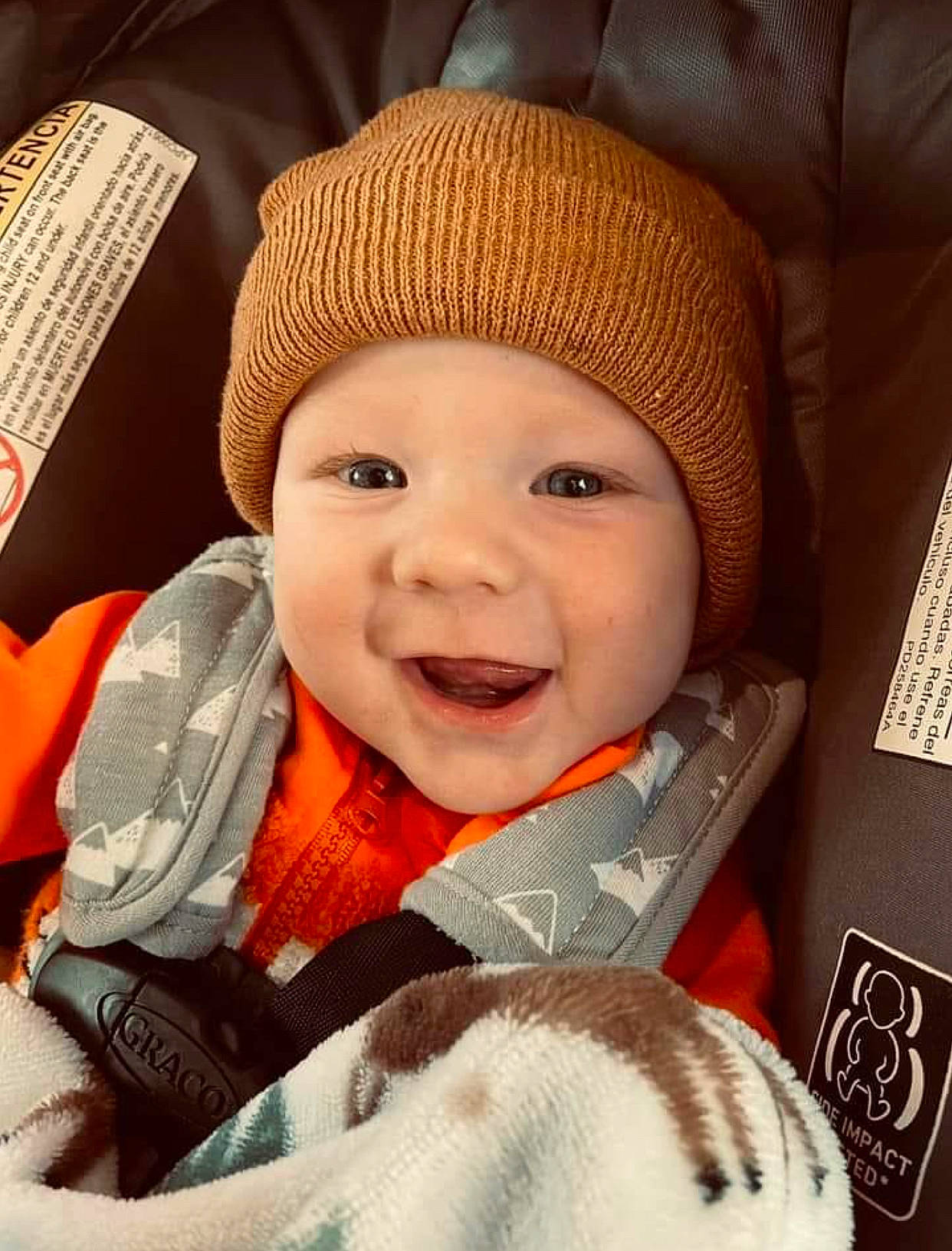 Colton is registered to the contest to win money with this photo: baby, baby_in_car_seat, baby_sleeping, baby_toddler_clothing, cap, cheek, comfort, cool, eye, facial_expression, happy, head, headgear, headwear, lip, nose, person, skin, sleeve, smile