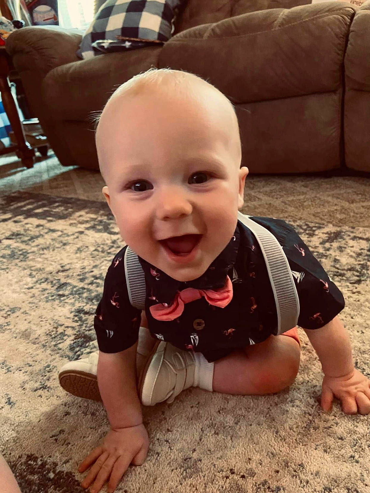 Colton is registered to the contest to win money with this photo: baby, baby_toddler_clothing, child, comfort, couch, facial_expression, floor, flooring, fun, furniture, grass, hairstyle, happy, joy, person, sitting, skin, smile, summer, t_shirt
