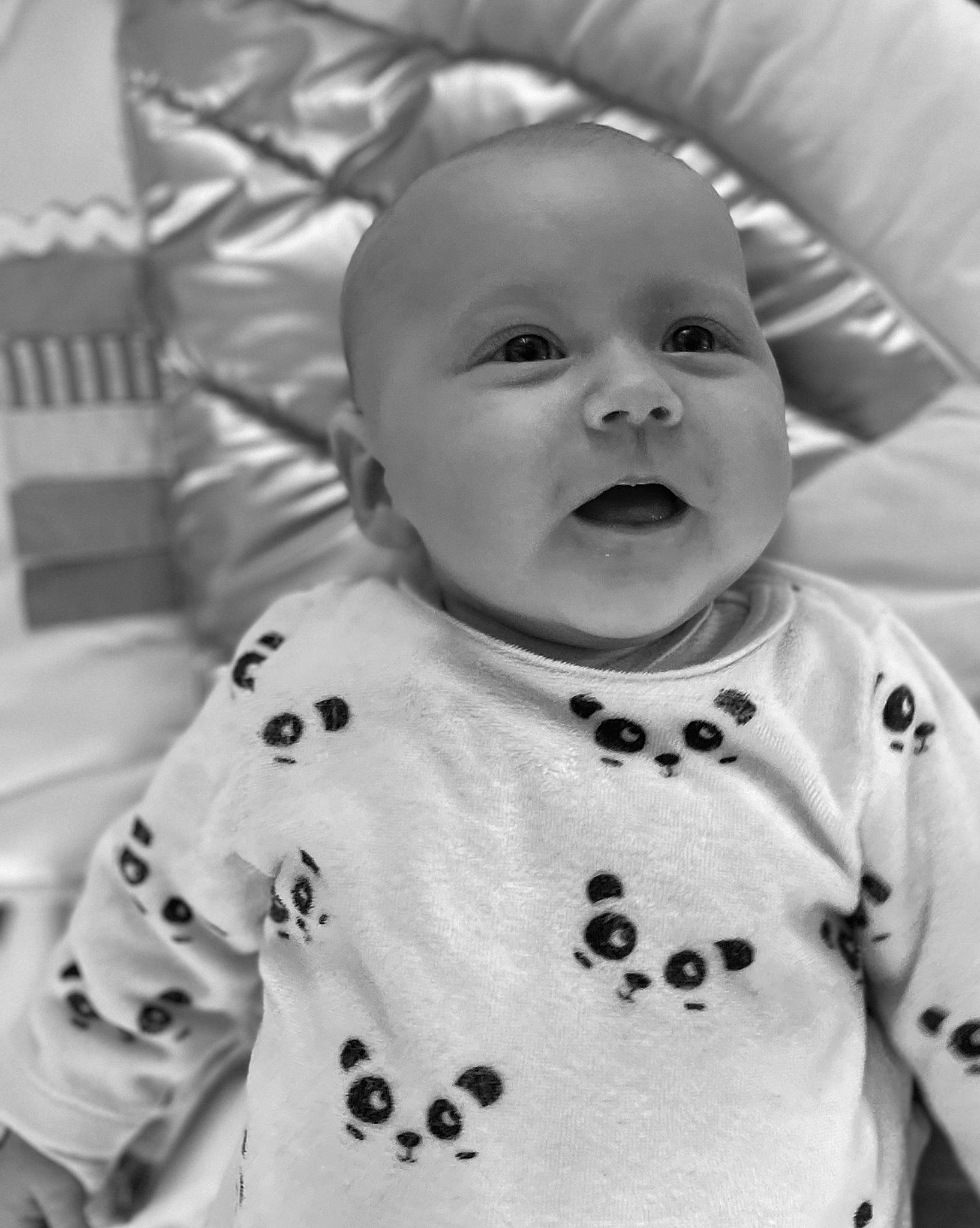 Lily participe au concours pour gagner de l'argent avec cette photo : baby, baby_toddler_clothing, black, cheek, chin, eye, face, happy, head, iris, lip, mouth, nose, person, product, skin, sleeve, smile, standing, textile