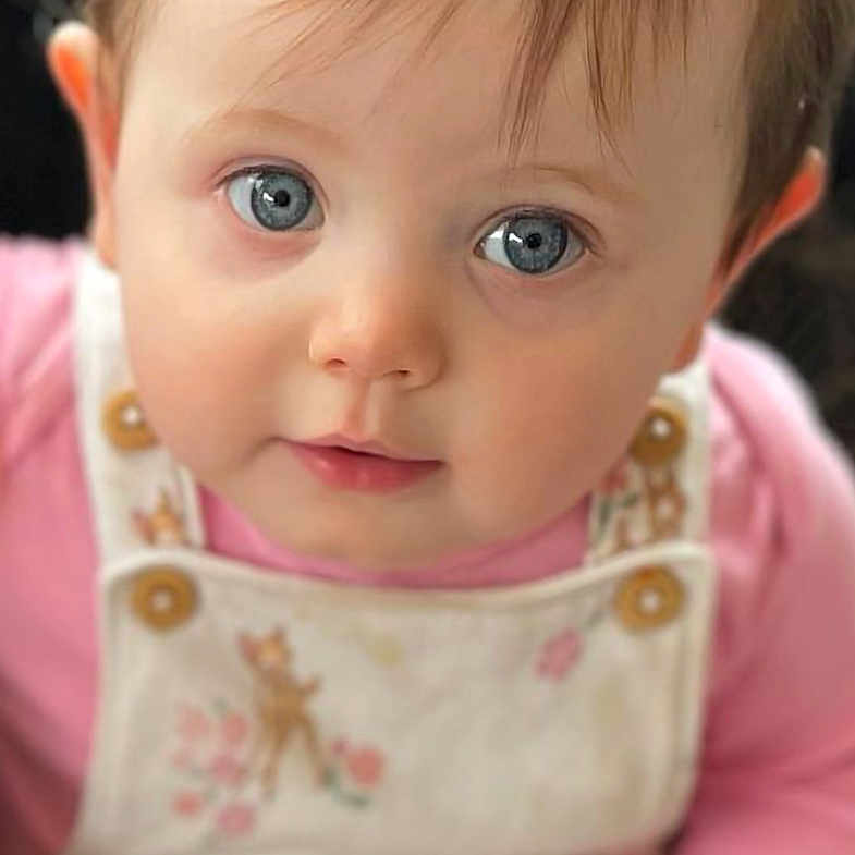 Neila Ruby joined the competition — help win amazing prizes! baby, blonde, clothing, couch, cushion, dress, face, furniture, hair, happy, head, homedecor, newborn, pants, person, photography, portrait, shirt, sitting, smile