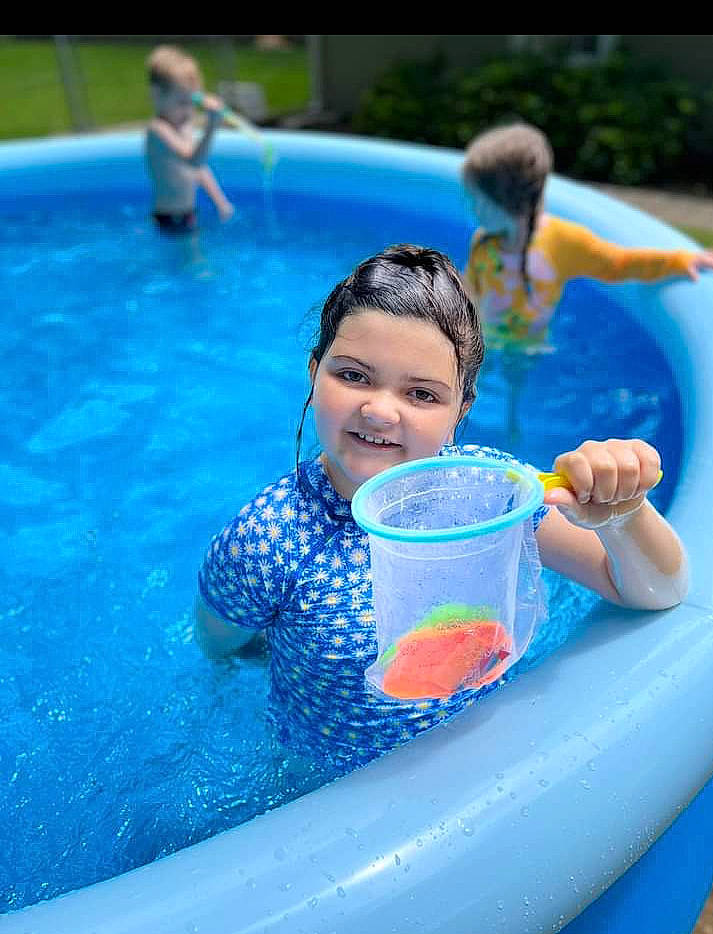 Ellie joined the competition — help win amazing prizes! aqua, azure, bathing, blue, child, fluid, fun, games, happy, inflatable, joy, leisure, leisure_centre, nonbuilding_structure, outdoor_recreation, person, play, recreation, smile, swimming_pool