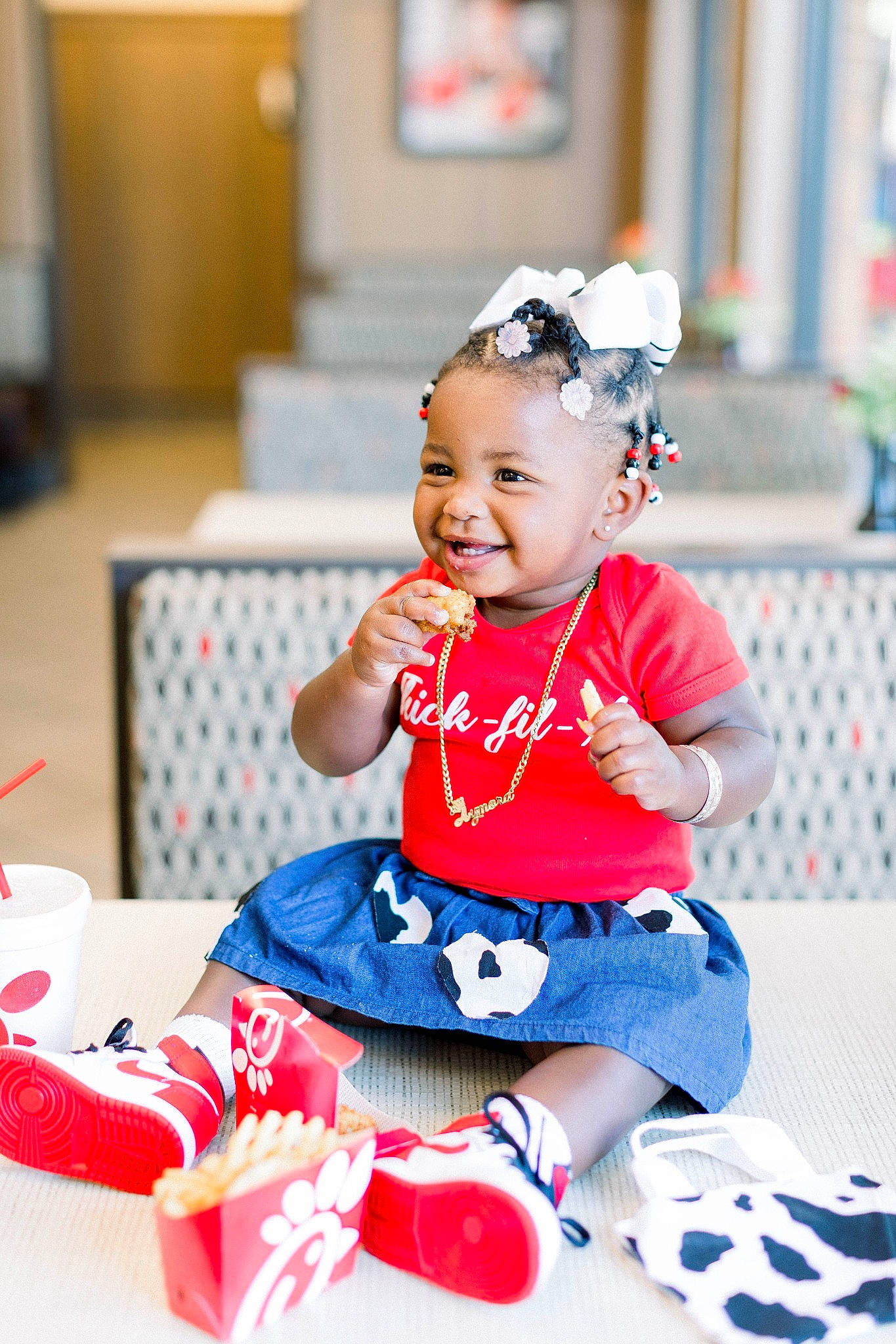 Aymora is registered to the contest to win money with this photo: baby, baby_toddler_clothing, child, dress, electric_blue, event, face, fashion_accessory, fun, happy, head, headband, joy, magenta, pattern, person, pink, recreation, sitting, sleeve