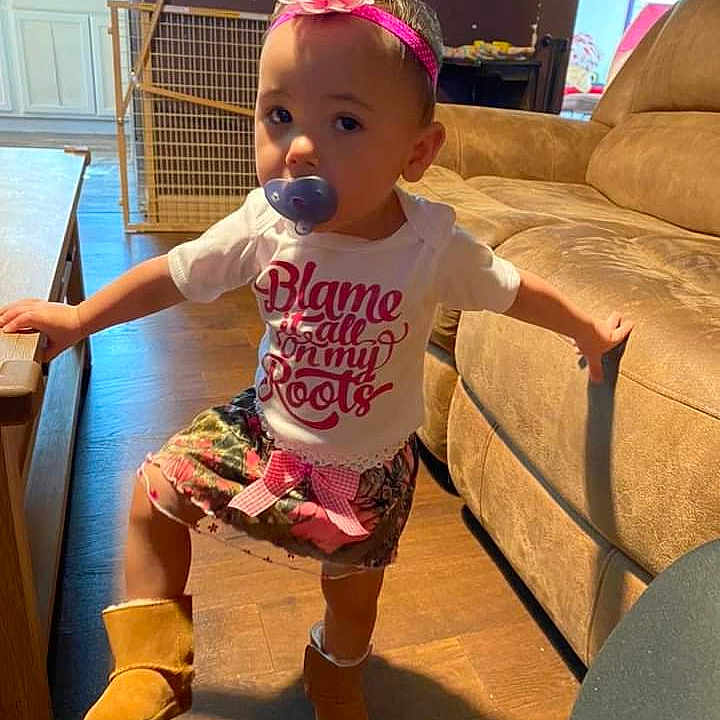 Phoenix joined the competition — help win amazing prizes! baby, baby_toddler_clothing, child, couch, flooring, fun, happy, hat, human_leg, knee, magenta, pink, play, room, sandal, sitting, sock, t_shirt, thigh, toddler