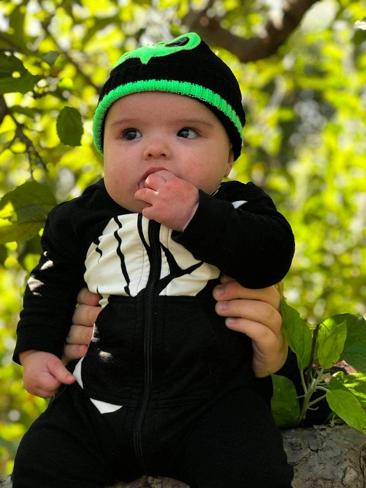 Jacob is registered to the contest to win money with this photo: baby, baby_toddler_clothing, child, clothing, eye, face, flash_photography, fruit, grass, happy, head, headgear, headwear, human_body, leaf, people_in_nature, person, personal_protective_equipment, plant, skin
