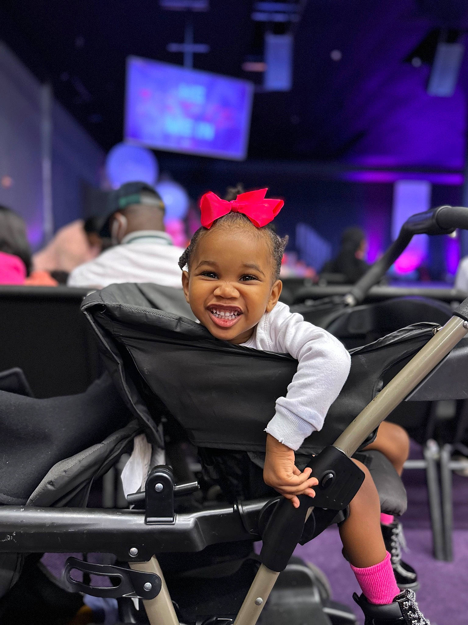 Kaydence is registered to the contest to win money with this photo: automotive_design, baby, baby_products, chair, child, comfort, entertainment, event, flash_photography, fun, happy, joy, leisure, luxury_vehicle, magenta, person, purple, sitting, smile, toddler