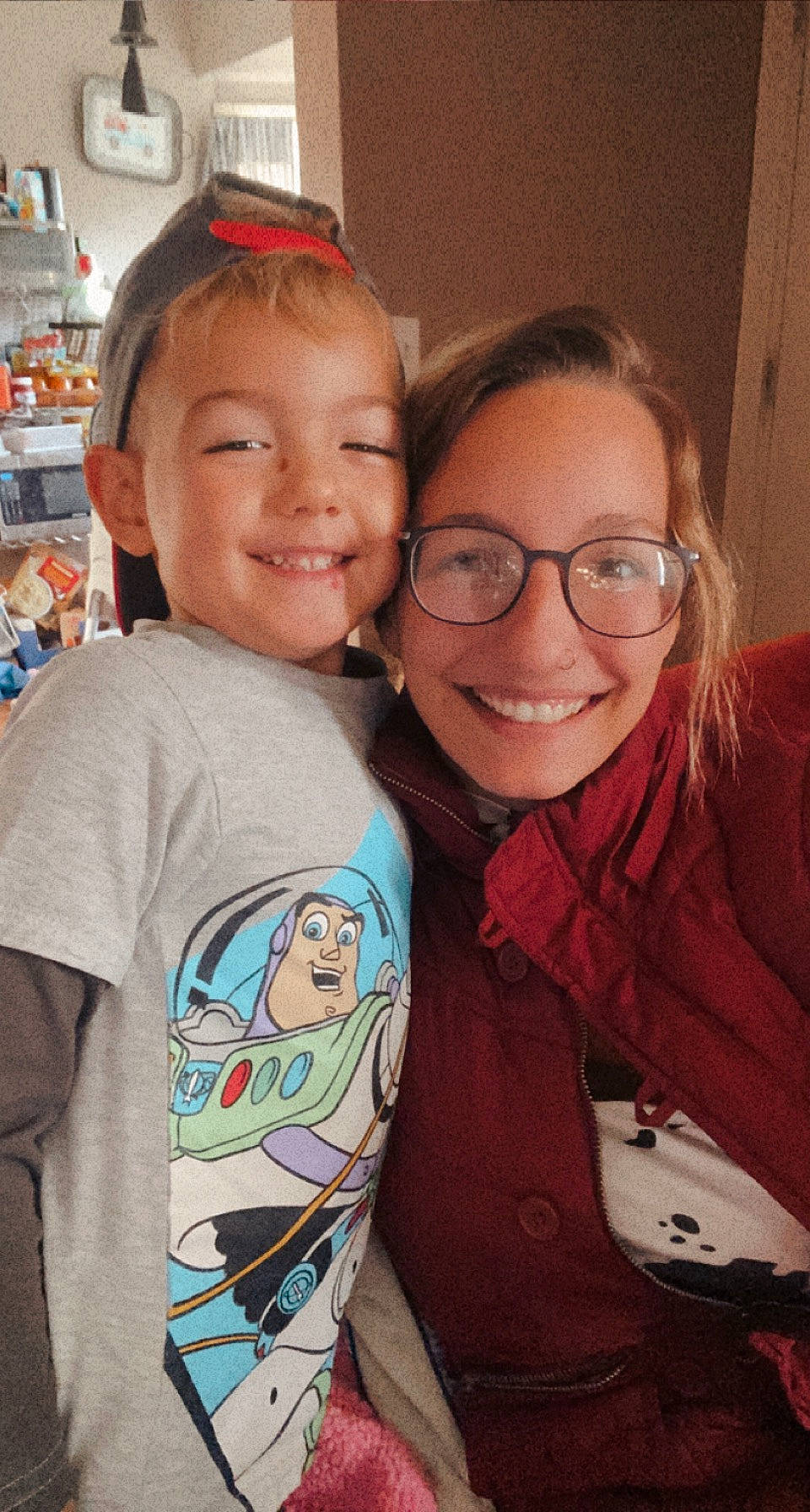 Braxton joined the competition — help win amazing prizes! cheek, chin, eye, eyewear, face, facial_expression, forehead, glasses, hair, happy, head, iris, joy, nose, person, shelf, skin, sleeve, smile, standing