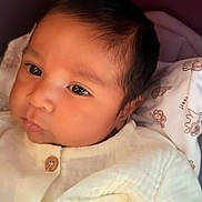 Chadwick joined the competition — help win amazing prizes! baby, infant, child, portrait, face, eyes, looking, awake, onesie, clothing, white_outfit, bee_design, smiling, cozy, blanket, crib, indoor, close_up, head, safe