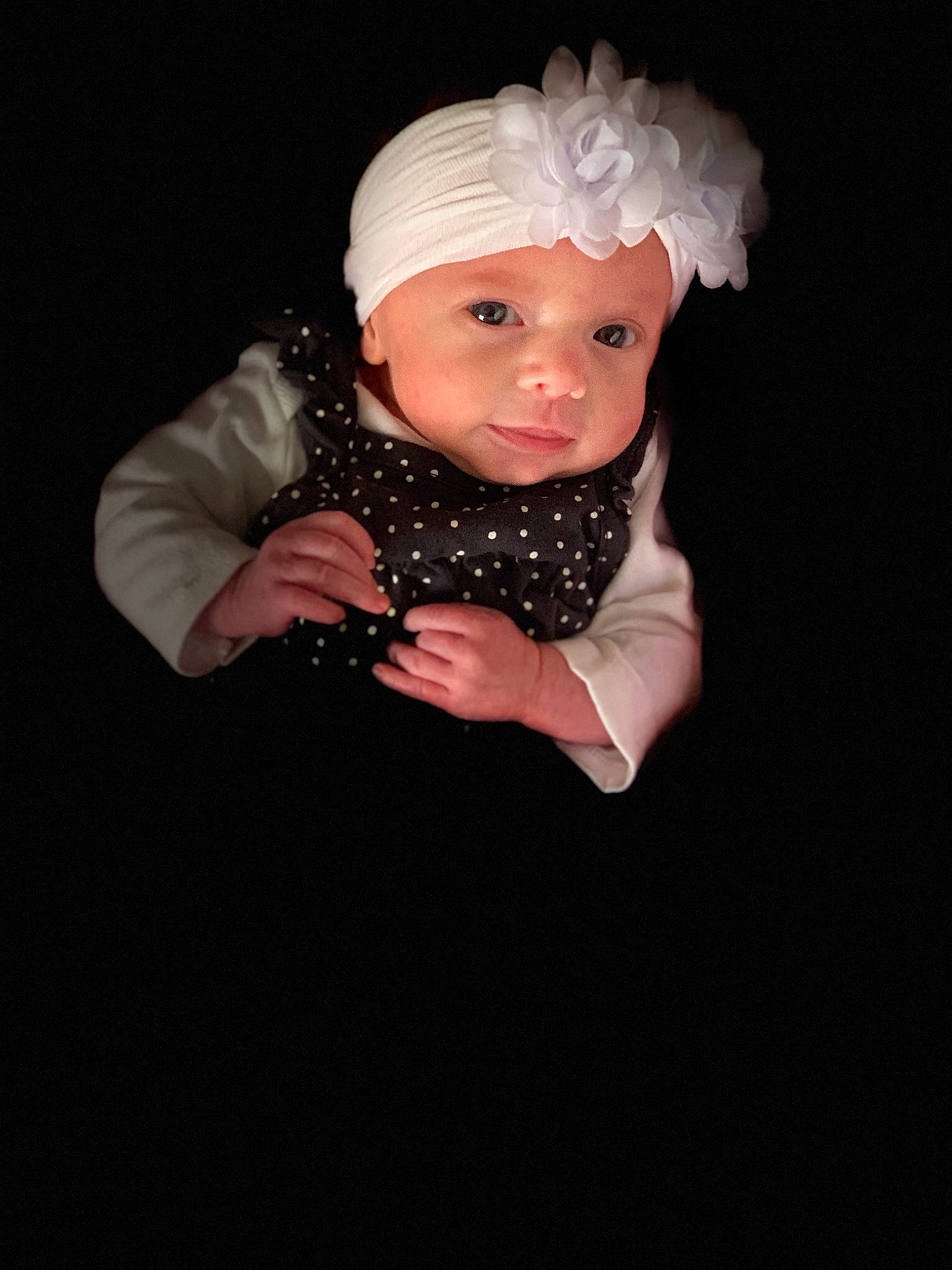 Evelynne Mae is registered to the contest to win money with this photo: baby, bonnet, child, child_model, costume_accessory, fashion_accessory, flash_photography, hair_accessory, hand, head, headgear, headpiece, person, photography, portrait, portrait_photography, smile, toddler, white