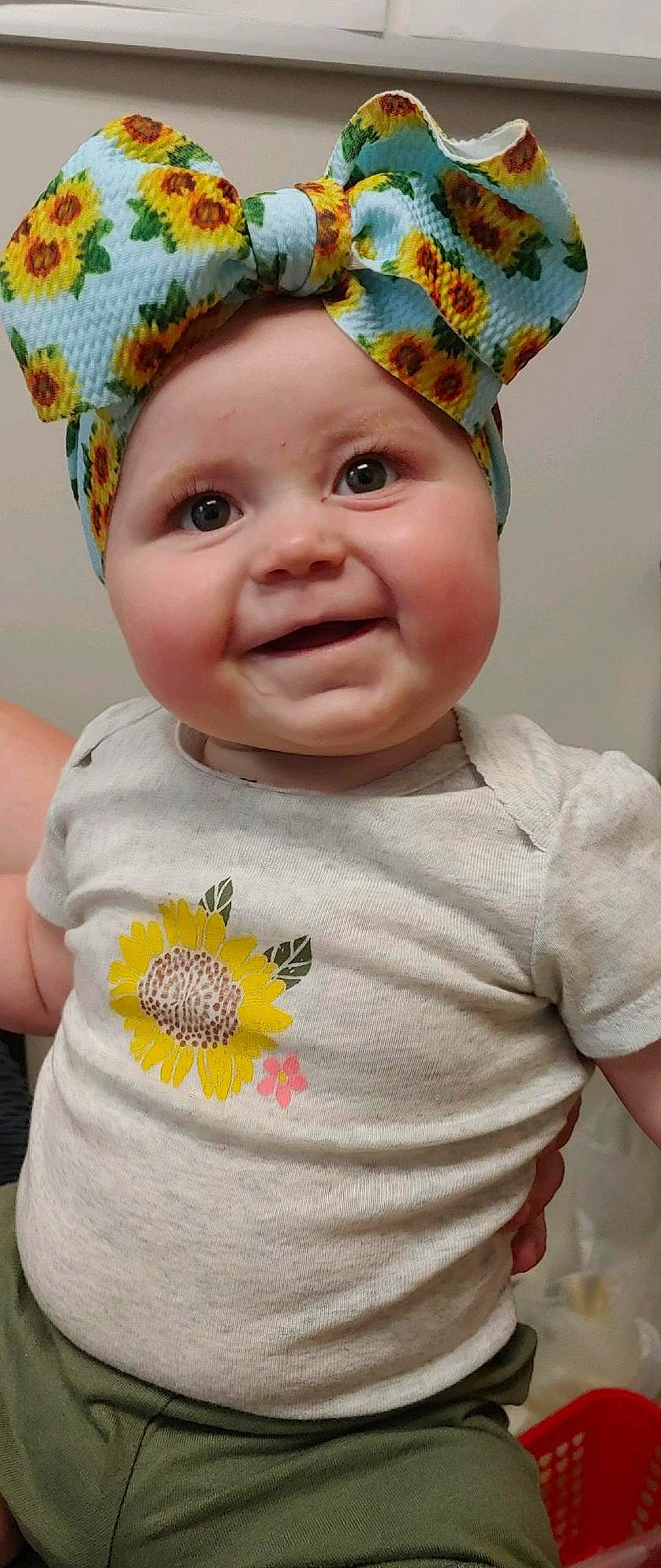 Hannah is registered to the contest to win money with this photo: baby, baby_toddler_clothing, cap, chin, costume_hat, eye, face, facial_expression, happy, hat, headwear, iris, organ, person, pink, skin, sleeve, smile, textile, toddler