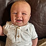 Arthur-James joined the competition — help win amazing prizes! baby, smiling, child, infant, white_shirt, anchor_emblem, polo_shirt, leather_couch, happy, cute, portrait, sitting, indoor, closeup, face, light_skin, short_hair, buttoned_shirt, casual_clothing, young_child